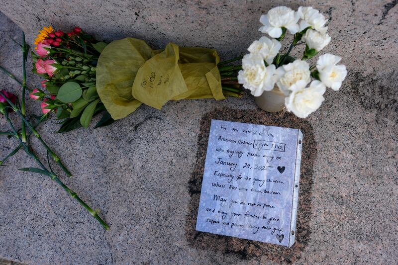 Flowers and a letter in memorial to the victims of the collision are pictured at the Titanic Memorial in Washington (Carolyn Kaster/AP)