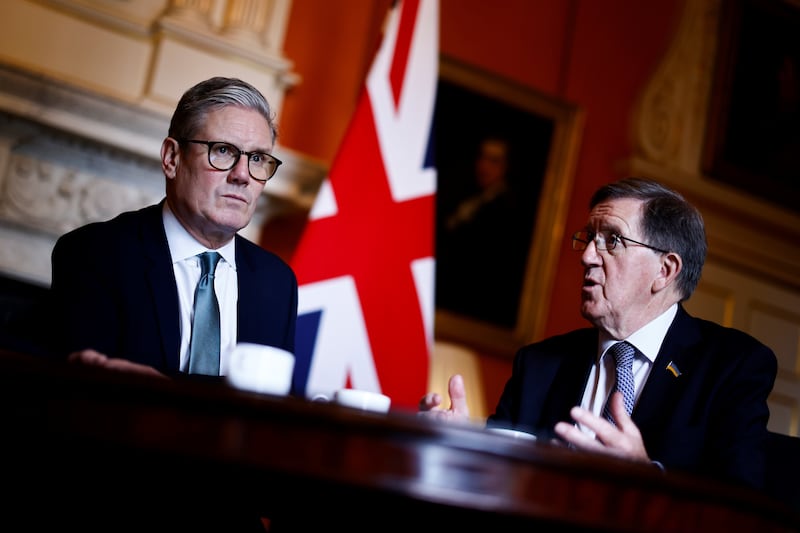 Lord Robertson (right) seen here with Prime Minister Sir Keir Starmer , will lead the strategic defence review,