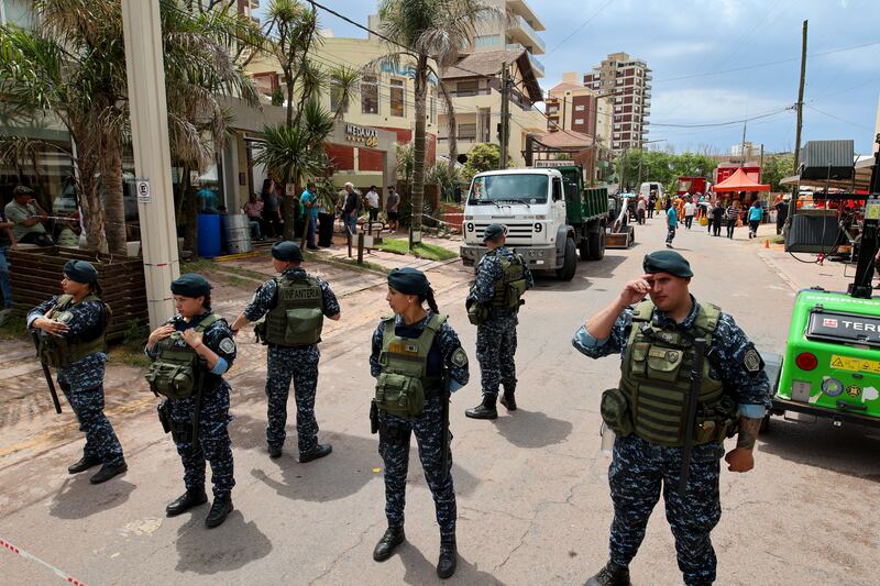 Police block a street leading to the Dubrovnik Hotel in Villa Gesell, Argentina (Christian Heit/AP)