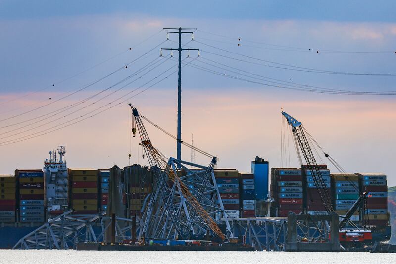 Workers start to remove a section of the collapsed Francis Scott Key Bridge (Julia Nikhinson/AP)