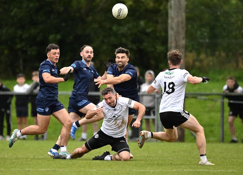 Tiernan McCann and Jason McAnulla battle for possession as Killyclogher and Omagh lock horns in Carrickmore. Picture: Oliver McVeigh