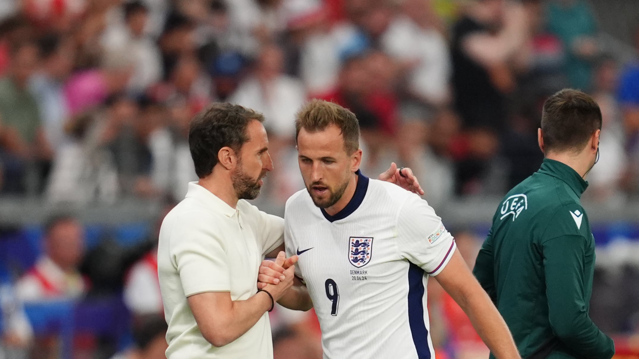 England’s Harry Kane shakes hands with manager Gareth Southgate after being substituted against Denmark.