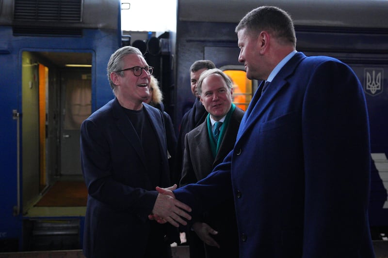 Sir Keir Starmer is greeted by Ukrainian officials and the British ambassador to Ukraine Martin Harris (centre, green tie)