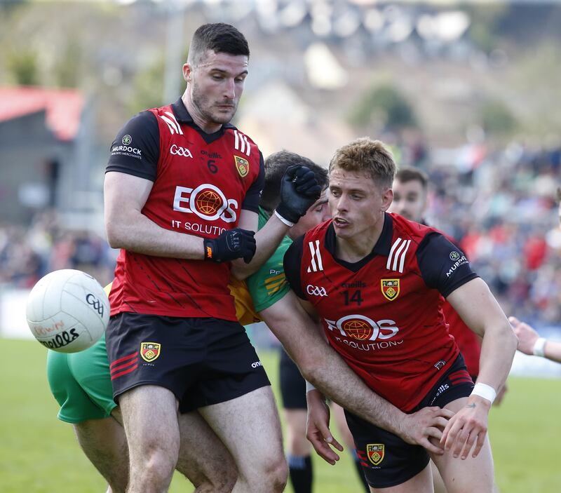 Niall McParland and Pat Havern win the ball as Down beat Donegal in the Ulster Championship
