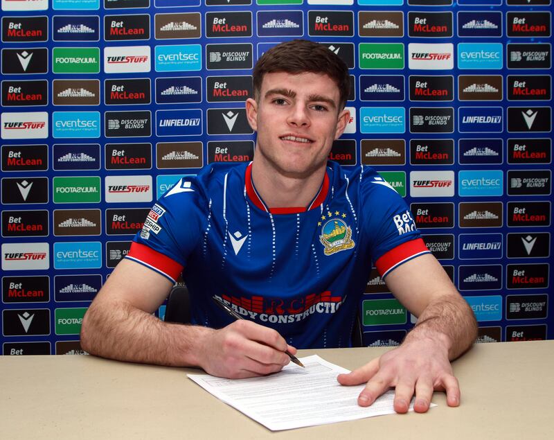 Kieran Offord signs for Linfield at Windsor Park on Sunday night