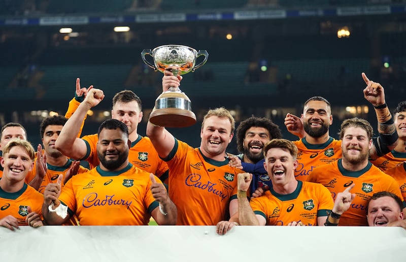 Australia celebrate regaining the Ella Mobbs Trophy at Twickenham