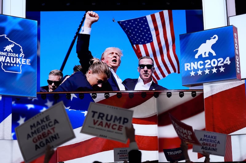 Pictures of the assassination attempt of Donald Trump displayed during the Republican National Convention on July 18 in Milwaukee (Jae C Hong/AP)