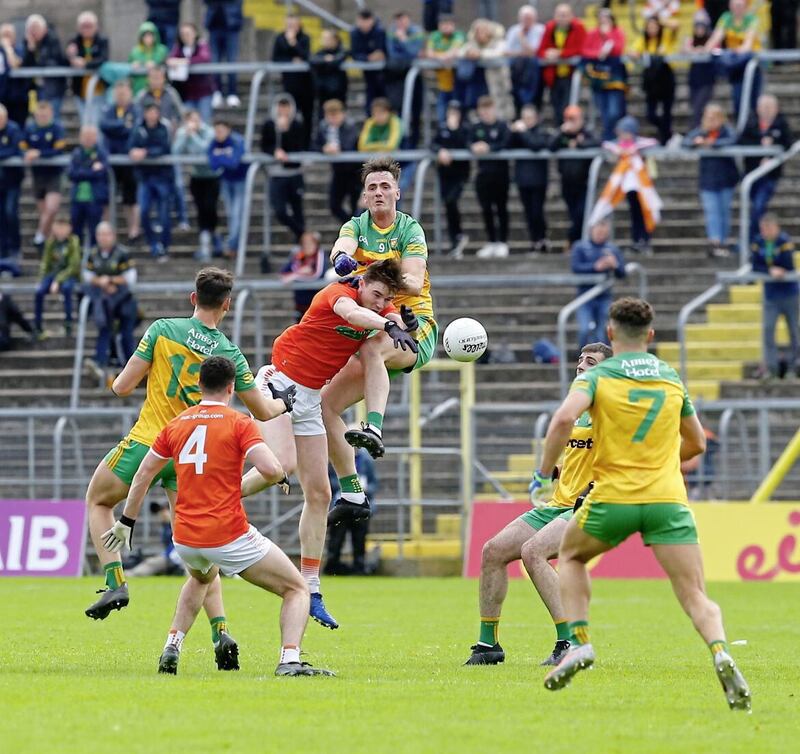 Armagh&#39;s Ben Crealey and Donegal&#39;s Jason McKee clash at Clones last year. Pic Philip Walsh. 