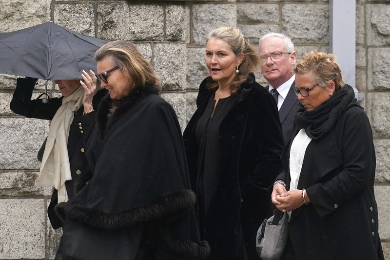 Mourners arrive for the funeral of Tony O’Reilly