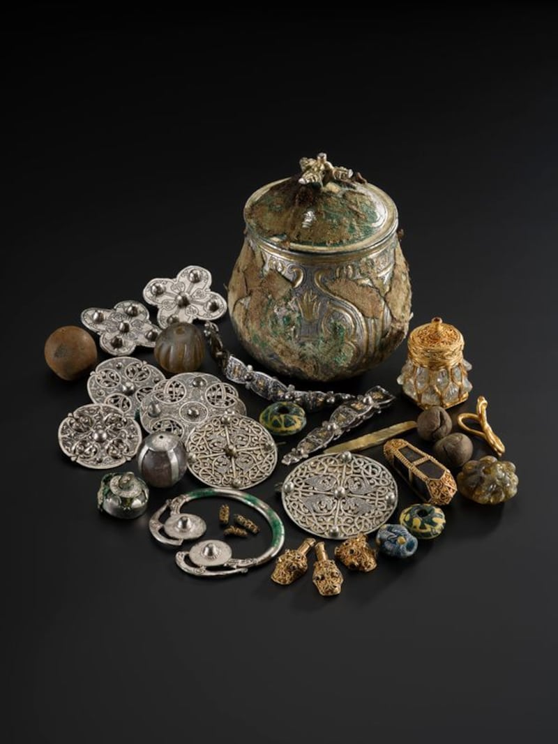 The Galloway Hoard vessel and the items discovered within. It is estimated to be around 1,100 years old.