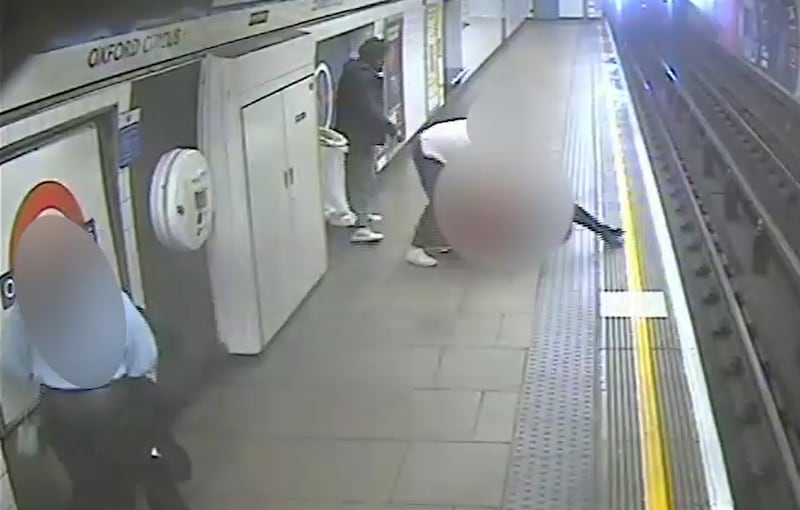 The victim managed to stay on his feet and a passerby helped him to climb back up on to the platform just as a train pulled into the station