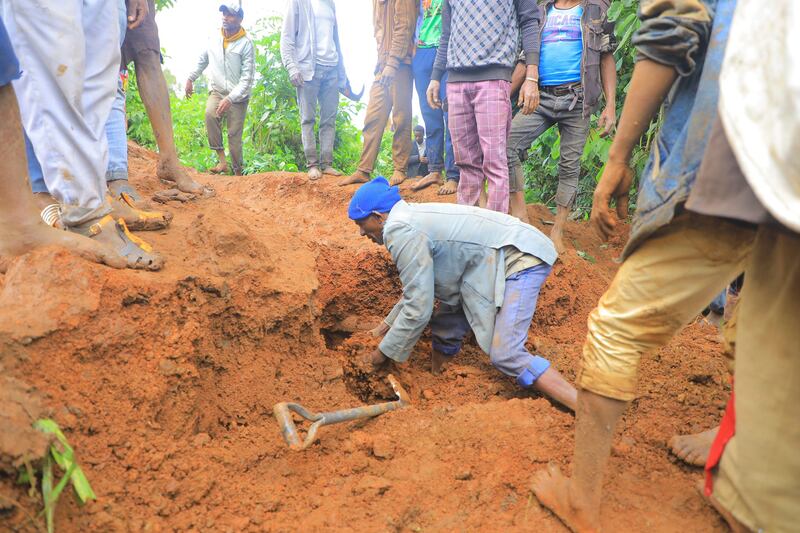 A man searches for survivors in the Kencho Shacha Gozdi district, southern Ethiopia (Isayas Churga/Gofa Zone Government Communication Affairs Department via AP)