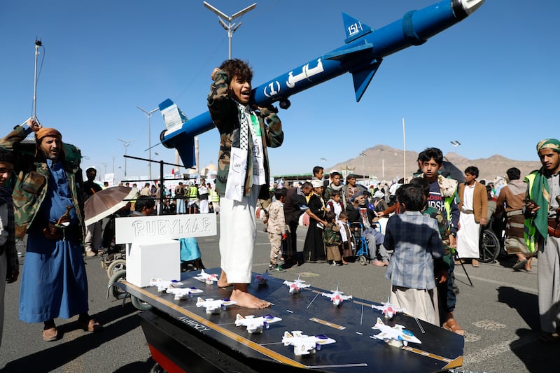 Houthi supporters attend a rally against the US-led strikes on Yemen and Israel’s war in Gaza (Osamah Abdulrahman/AP)