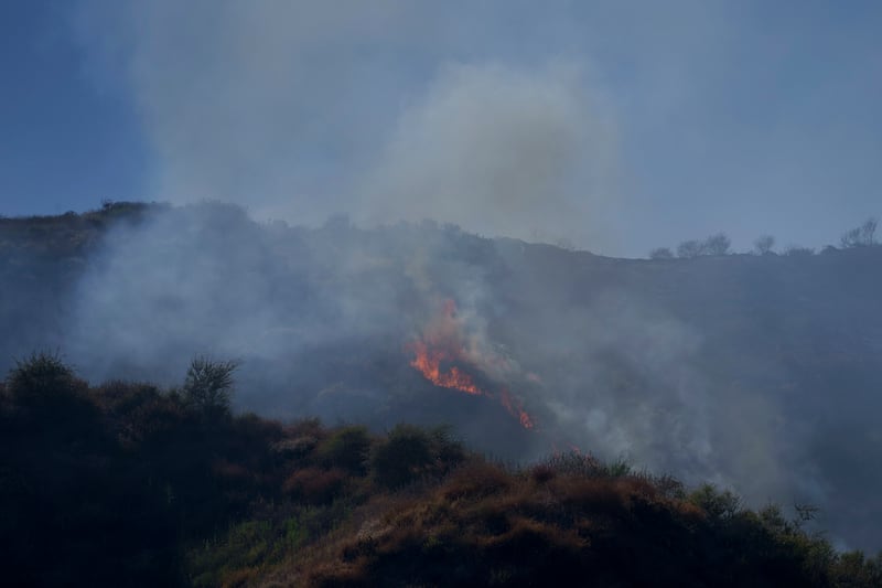 Flames burn on a hillside during the Sharp Fire in Simi Valley (Eric Thayer/AP)
