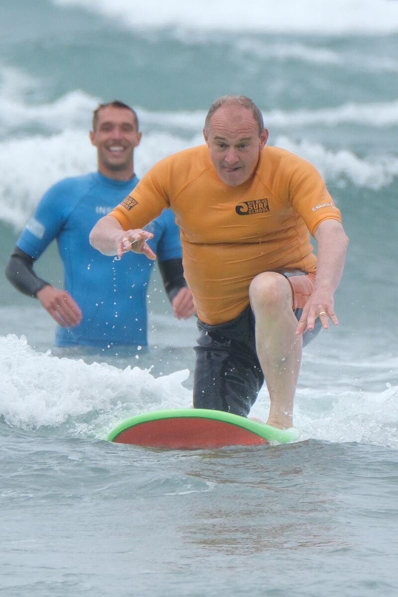 Liberal Democrat leader Sir Ed Davey on a surfboard
