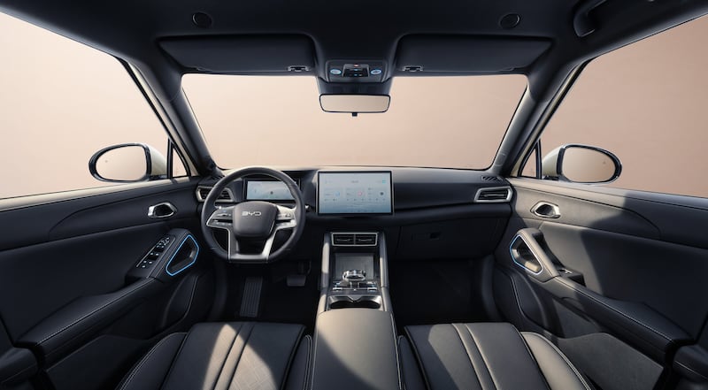 The interior features a large infotainment screen and physical shortcut buttons. (BYD)