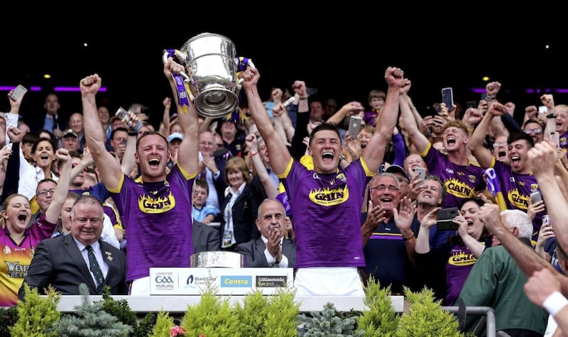 Wexford joint captains Matthew O&#39;Hanlon and Lee Chin raise the Bob O&#39;Keeffe Cup Picture: Seamus Loughran. 