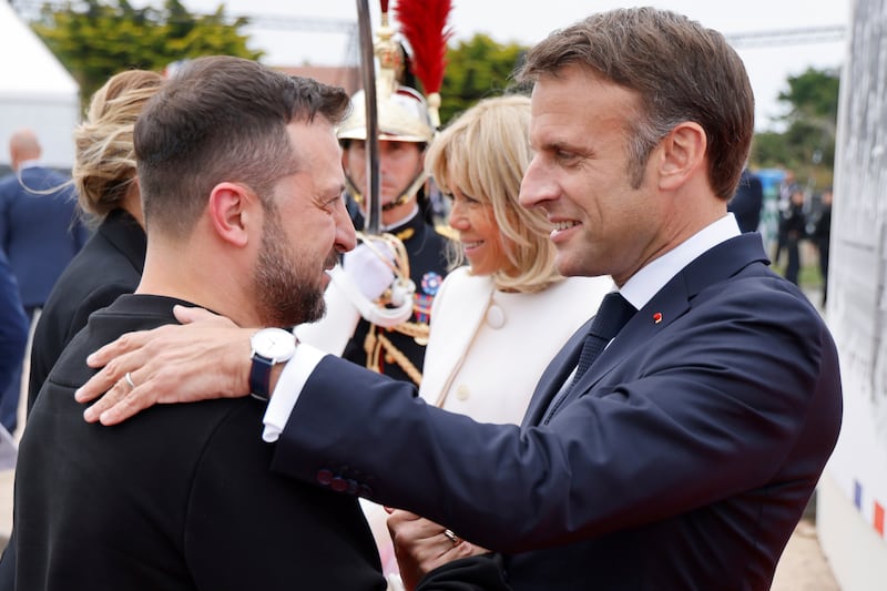 Ukrainian President Volodymyr Zelensky is greeted by French President Emmanuel Macron (Ludovic Marin/AP)