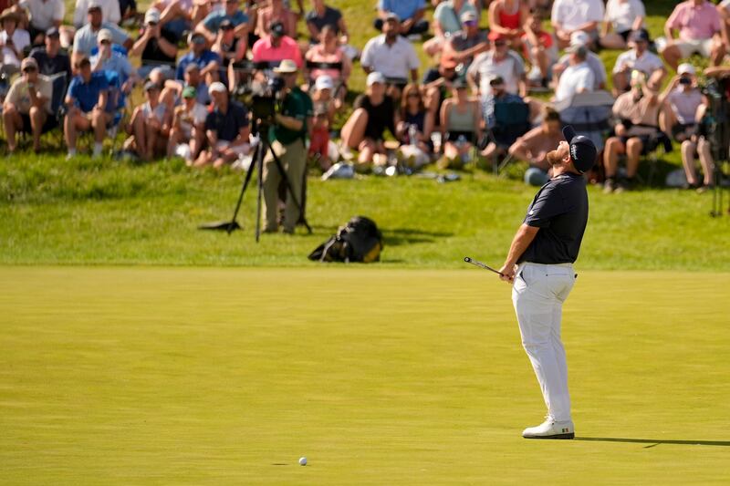 Shane Lowry reacts after missing a birdie putt on the 18th hole to record the first ever 61 in a men’s major (Jeff Roberson/AP)