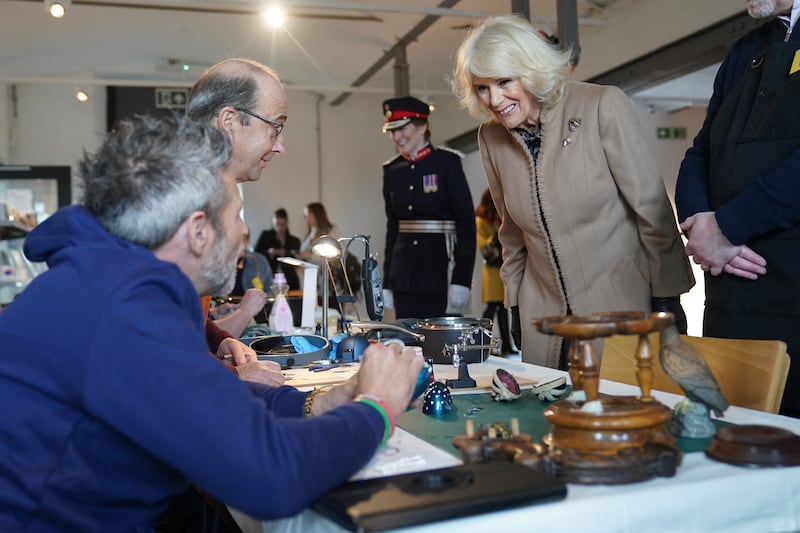 Queen Camilla takes a look at items given a new lease of life by the Shrewsbury Repair Cafe