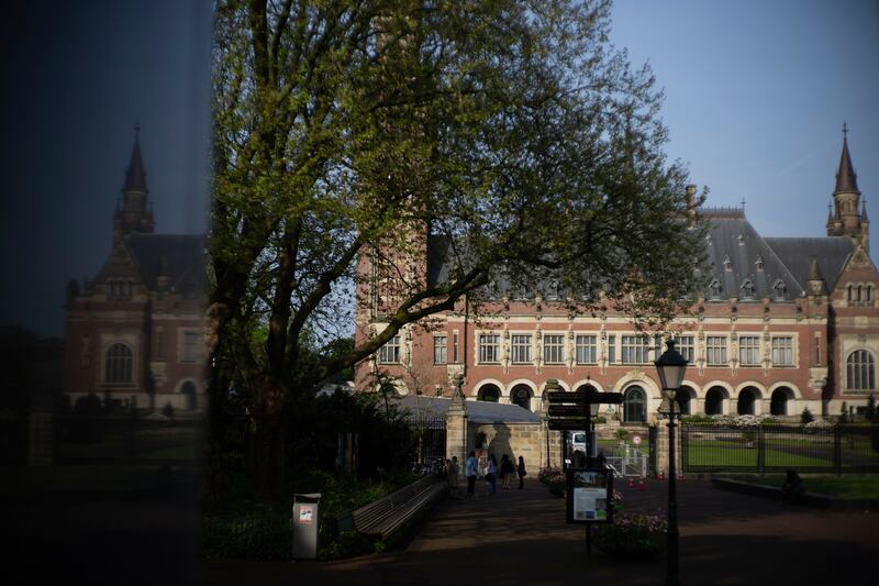 The Peace Palace housing the International Court of Justice is reflected in a monument in The Hague (AP/Peter Dejong)