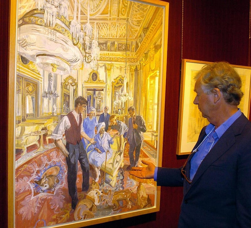 Artist John Wonnacott gestures towards his group portrait of the royal family commissioned by the Portrait Gallery for the Millennium at Agnew’s gallery in Mayfair, London, in 2005 (Michael Stephens/PA)