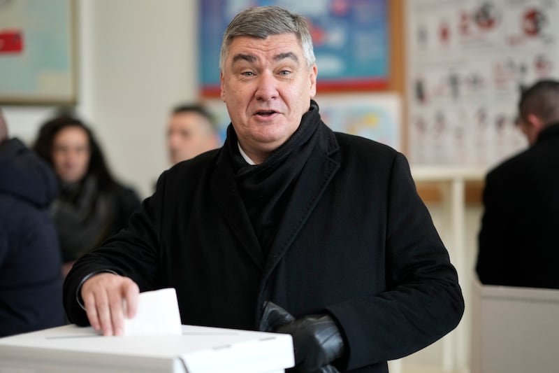 Zoran Milanovic casts his ballot at a polling station in Zagreb (Darko Bandic/AP)