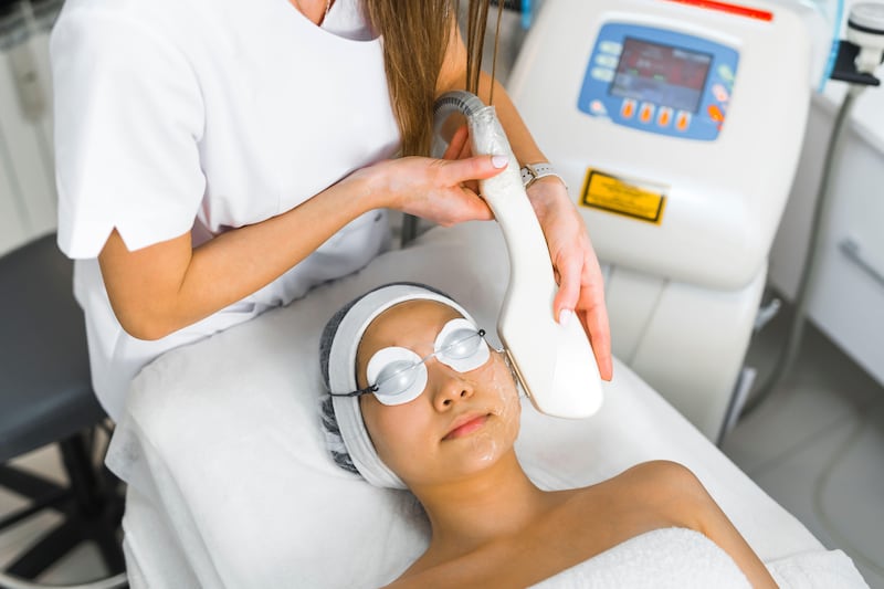 woman receiving a fractional laser face treatment