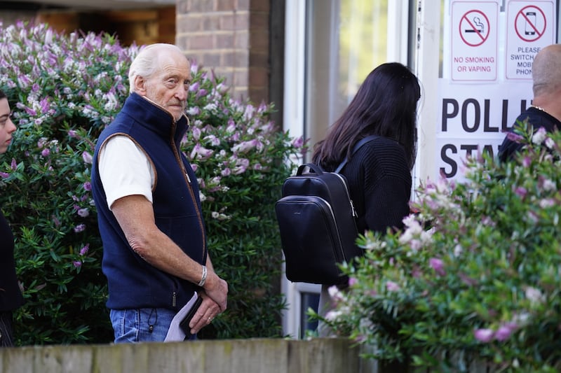 Actor Charles Dance waits to cast his vote