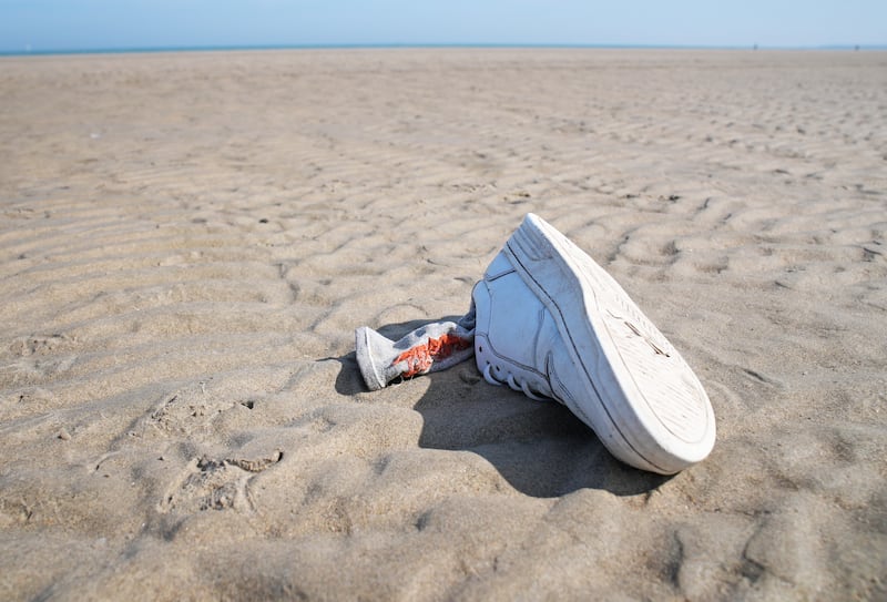 Belongings of people thought to be migrants are left on the beach in Gravelines, France