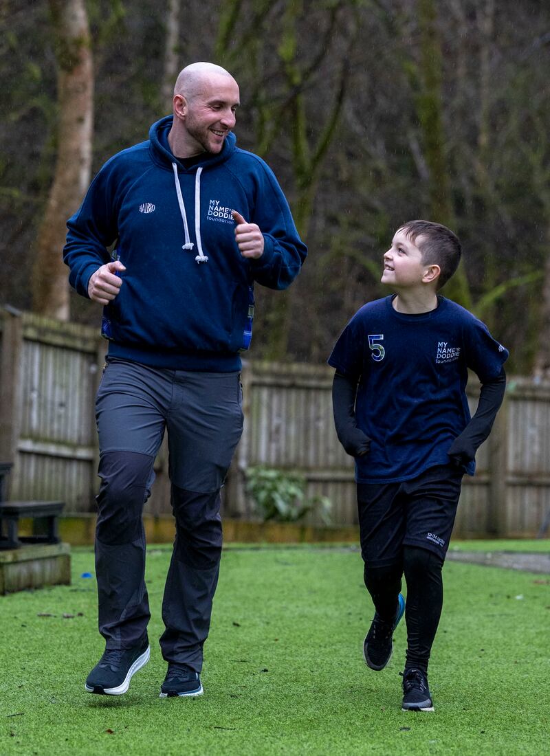 Harvey Dooher, 10, with dad David Dooher .