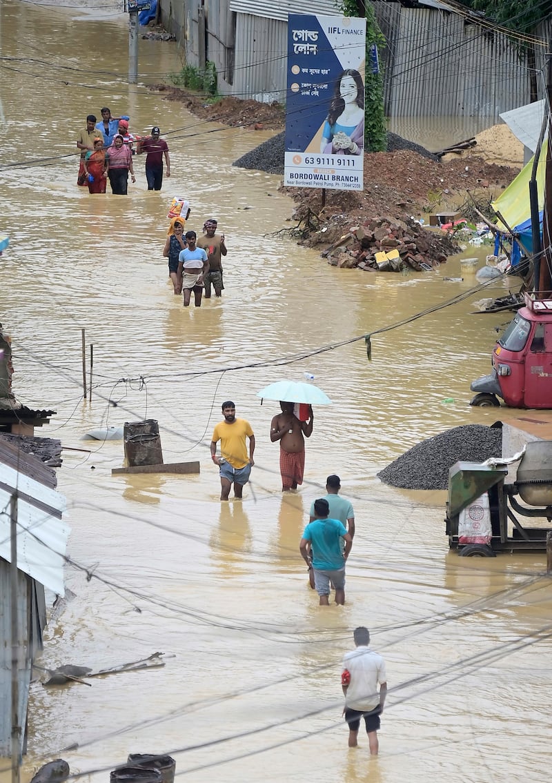 Residents flee in Agartala, Tripura state (Abhisek Saha/AP)