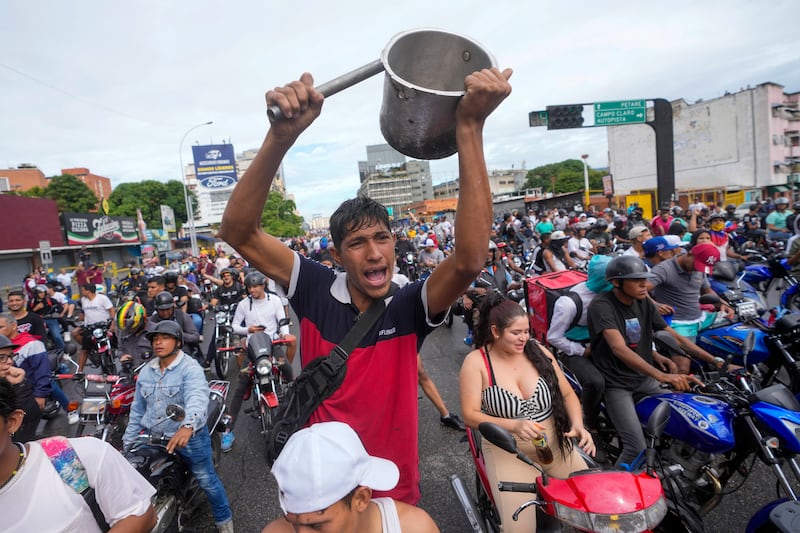 People protest the results in Caracas (Fernando Vergara/AP)