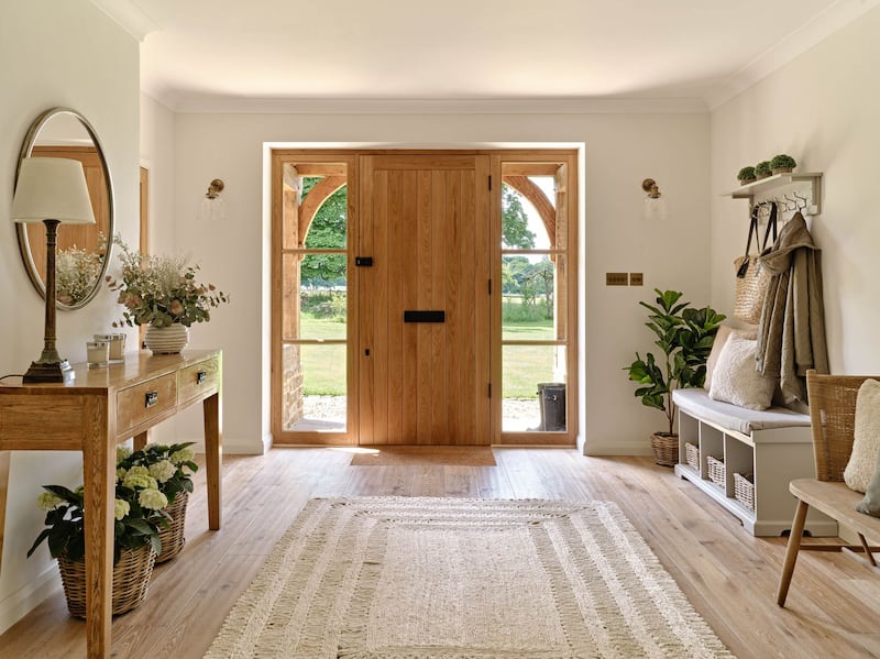 A light-filled entryway makes a warm and welcoming first impression