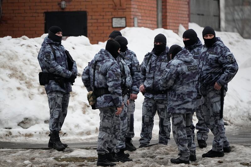 Riot police officers guard the area near the Church of the Icon of the Mother of God Soothe My Sorrows, in Moscow on Friday (AP)