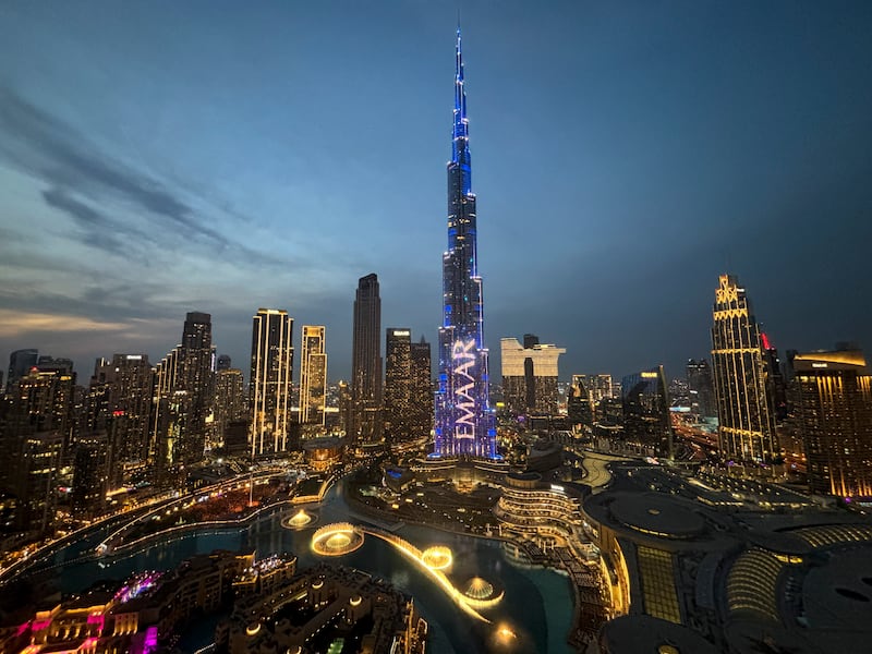 Lights illuminate Burj Khalifa, the world’s tallest building, ahead of the New Year’s Eve celebration, in Dubai (Altaf Qadri/AP)