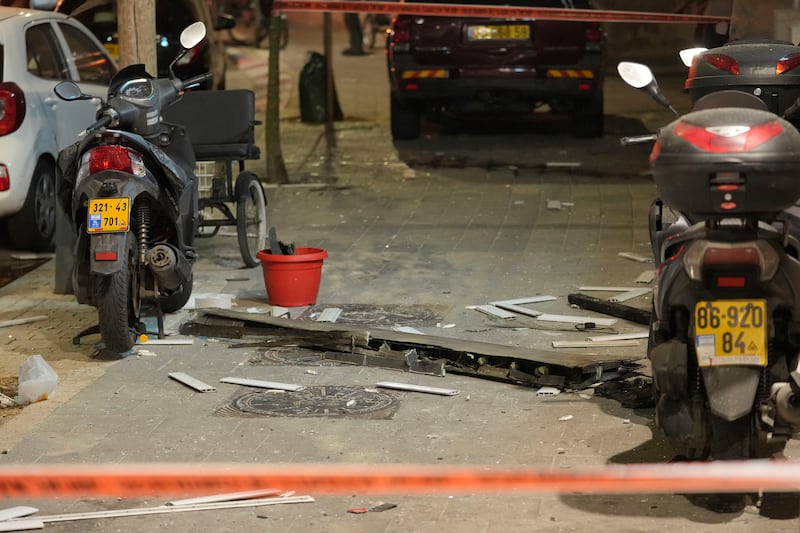 Caution tape surrounds debris at the scene (Erik Marmor/AP)