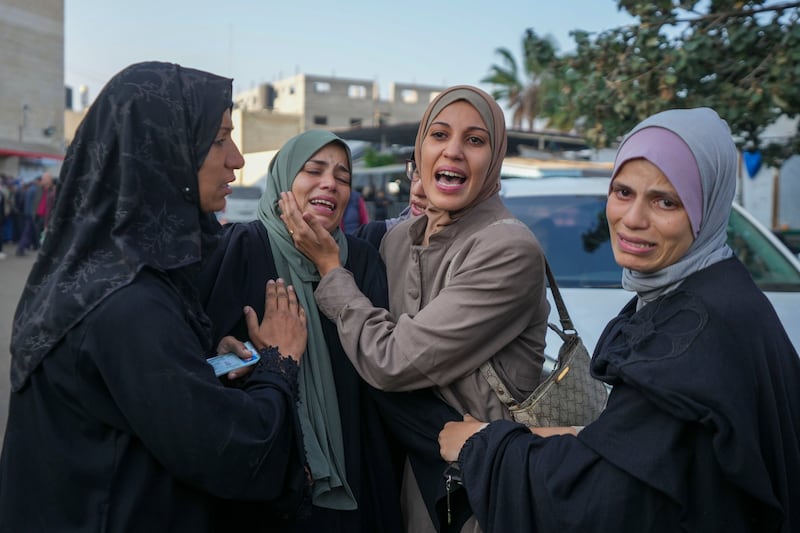 Palestinian women mourn over victims following an Israeli bombardment, at the Al-Aqsa Martyrs Hospital in Deir al-Balah, Gaza Strip (Abdel Kareem Hana/AP)