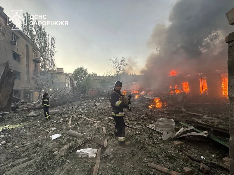 Firefighters tackle a blaze following a guided bomb attack overnight in Zaporizhzhia (Ukrainian Emergency Service/AP)