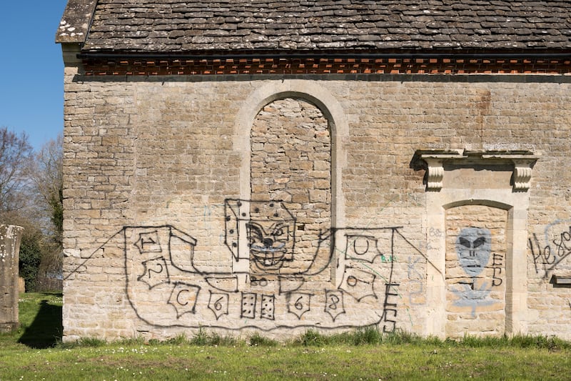 Graffiti on the side of Holy Rood Chapel in Swindon, Wiltshire.