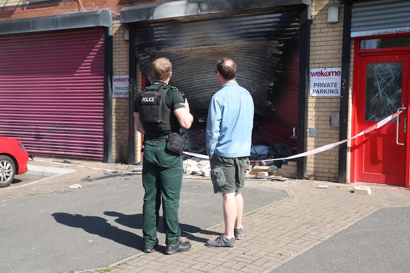 A car was driven into the Welcome Centre on Townsend Street and set on fire. PICTURE: MAL MCCANN