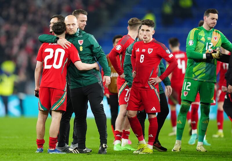 Daniel James (left) is consoled after Wales’ Euro 2024 play-off final defeat to Poland in March