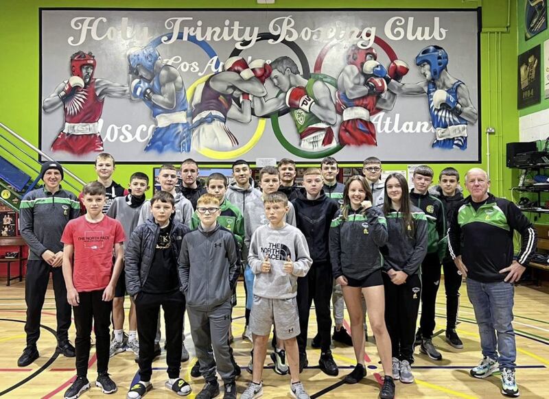 <span style="color: rgb(51, 51, 51); font-family: sans-serif, Arial, Verdana, &quot;Trebuchet MS&quot;; ">Holy Trinity were celebrating after coming home with a haul of 15 titles at last week&rsquo;s Antrim 12 championships, which were held in Corpus Christi Boxing Club. &ldquo;It was really good to get them all back, and it was great to see such a big entry in what was the first County Antrim competition in 20 months,&rdquo; said coach Michael Hawkins j</span><span style="color: rgb(51, 51, 51); font-family: sans-serif, Arial, Verdana, &quot;Trebuchet MS&quot;; ">r, &ldquo;everybody is boxing well and excited for the future&rdquo;. Pictured with Hawkins and father</span><span style="color: rgb(51, 51, 51); font-family: sans-serif, Arial, Verdana, &quot;Trebuchet MS&quot;; ">, Michael s</span><span style="color: rgb(51, 51, 51); font-family: sans-serif, Arial, Verdana, &quot;Trebuchet MS&quot;; ">r, are Morgan Mallon, Kieran Hughes, Tony Crickard, Jimmy Doherty, JJ Carlin, Brendan Ferran, Tiernan Morris, Cody Johnston, Michael Marlow, Cormac Fegan, Aleesha Deronja, Summer Flemming, Bronco Braniff, Logan Rice, Conor Braniff, Joseph Mallon, Dylan Conville, Daniel Owens and Rhys Hall. Meanwhile, the Ulster 9 County Boy/Girl 123 championships will take place at the Shantallow Community Centre in Derry on the weekends of November 6-7 and 13-14 (dependent on entries)</span>