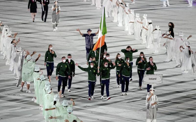 Ireland flagbearers Kellie Harrington and Brendan Irvine lead out the team during the opening ceremony of the Tokyo 2020 Olympic Games last summer. Picture by PA 