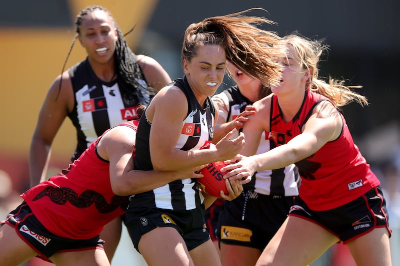 MELBOURNE, AUSTRALIA - SEPTEMBER 30: Aishling Sheridan of the Magpies is tackled during the round five AFLW match between Collingwood Magpies and Essendon Bombers at Punt Road Oval, on September 30, 2023, in Melbourne, Australia. (Photo by Kelly Defina/AFL Photos/via Getty Images)