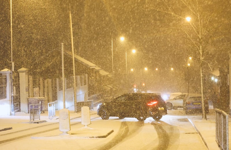 Snow Falls on the Ligoniel Road on Monday evening.
PICTURE COLM LENAGHAN