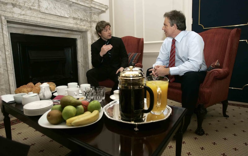 Celebrity TV chef Jamie Oliver speaks to then-prime minister Tony Blair after delivering a petition demanding better food for pupils