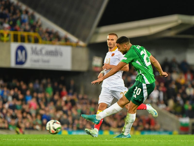 Brodie Spencer of NI fires in the shot which was turned into his own net by Dimitar Mitov of Bulgaria.