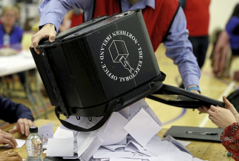 Ballot boxes are opened at Omagh leisure centre. Picture by Brian Lawless/PA Wire 