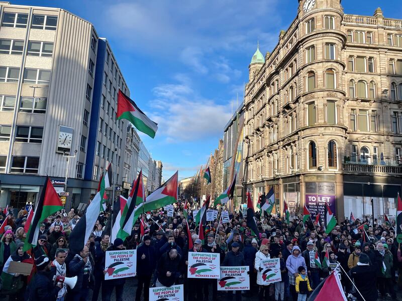 People take part in a pro-Palestine march and rally at Belfast City Hall